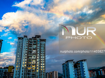 A photo is showing a rainbow over Nanchuan urban area in Chongqing, China, on July 12, 2024. (