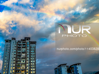 A photo is showing a rainbow over Nanchuan urban area in Chongqing, China, on July 12, 2024. (