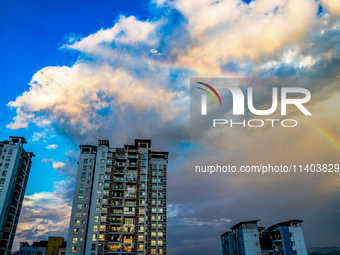 A photo is showing a rainbow over Nanchuan urban area in Chongqing, China, on July 12, 2024. (