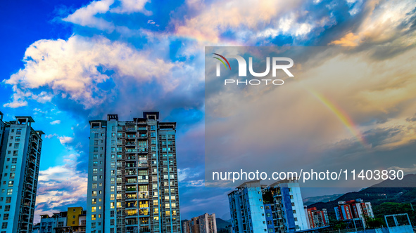 A photo is showing a rainbow over Nanchuan urban area in Chongqing, China, on July 12, 2024. 