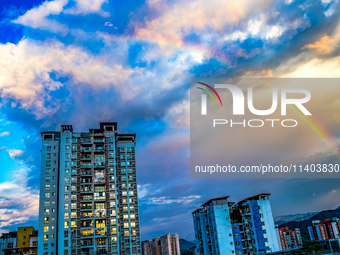 A photo is showing a rainbow over Nanchuan urban area in Chongqing, China, on July 12, 2024. (