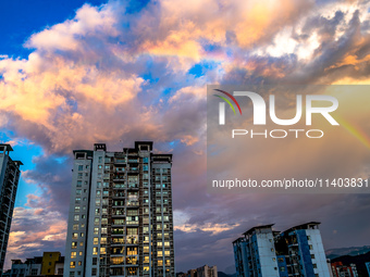 A photo is showing a rainbow over Nanchuan urban area in Chongqing, China, on July 12, 2024. (