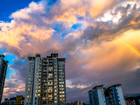 A photo is showing a rainbow over Nanchuan urban area in Chongqing, China, on July 12, 2024. (