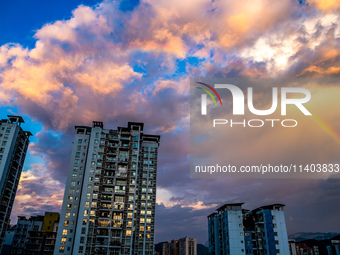 A photo is showing a rainbow over Nanchuan urban area in Chongqing, China, on July 12, 2024. (