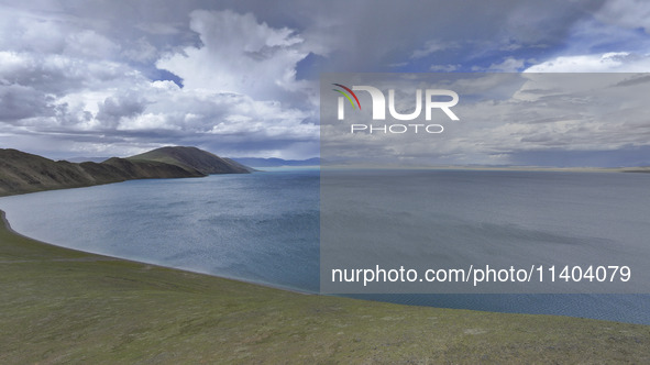 Tourists are enjoying the scenery of Bamucuo Lake in Nagqu, China, on July 12, 2024. 