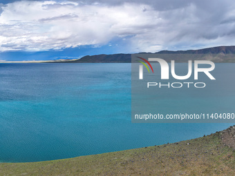 Tourists are enjoying the scenery of Bamucuo Lake in Nagqu, China, on July 12, 2024. (