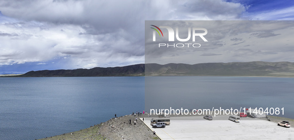 Tourists are enjoying the scenery of Bamucuo Lake in Nagqu, China, on July 12, 2024. 