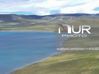 Tourists are enjoying the scenery of Bamucuo Lake in Nagqu, China, on July 12, 2024. (