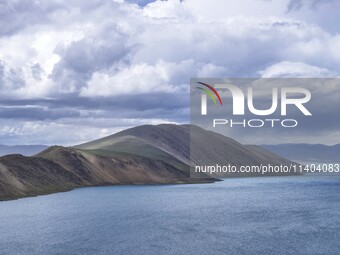 Tourists are enjoying the scenery of Bamucuo Lake in Nagqu, China, on July 12, 2024. (