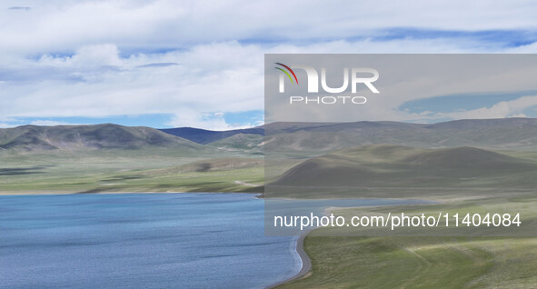 Tourists are enjoying the scenery of Bamucuo Lake in Nagqu, China, on July 12, 2024. 