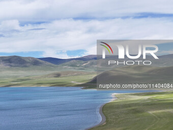 Tourists are enjoying the scenery of Bamucuo Lake in Nagqu, China, on July 12, 2024. (