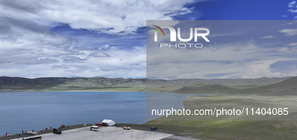 Tourists are enjoying the scenery of Bamucuo Lake in Nagqu, China, on July 12, 2024. 