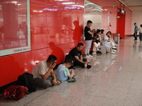 Citizens are cooling off at a subway station in Xi'an, China, on July 12, 2024. (