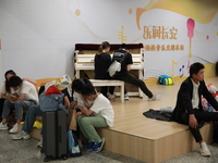 Citizens are cooling off at a subway station in Xi'an, China, on July 12, 2024. (