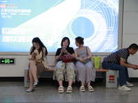 Citizens are cooling off at a subway station in Xi'an, China, on July 12, 2024. (