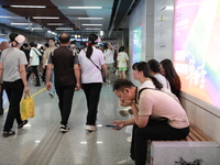 Citizens are cooling off at a subway station in Xi'an, China, on July 12, 2024. (