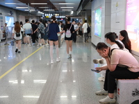 Citizens are cooling off at a subway station in Xi'an, China, on July 12, 2024. (