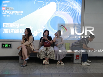 Citizens are cooling off at a subway station in Xi'an, China, on July 12, 2024. (