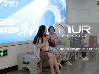 Citizens are cooling off at a subway station in Xi'an, China, on July 12, 2024. (