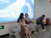 Citizens are cooling off at a subway station in Xi'an, China, on July 12, 2024. (