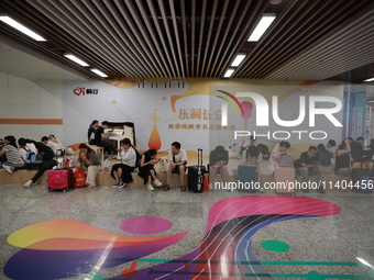 Citizens are cooling off at a subway station in Xi'an, China, on July 12, 2024. (