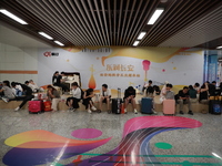 Citizens are cooling off at a subway station in Xi'an, China, on July 12, 2024. (