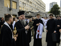 Metropolitan Epiphanius, the head of the Orthodox Church of Ukraine, is praying at the ruins of Okhmatdyt Children's Hospital that was recen...