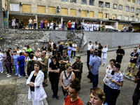 Medical workers are hearing as Conductor Herman Makarenko and the Kyiv Classic Orchestra are performing ''Requiem for the Dead'' at the ruin...