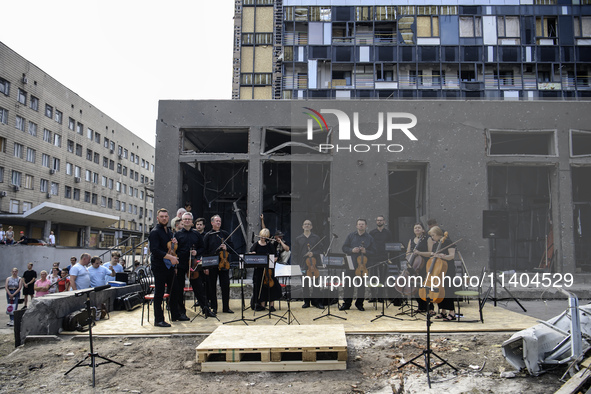 Conductor Herman Makarenko and the Kyiv Classic Orchestra are performing ''Requiem for the Dead'' at the ruins of Okhmatdyt Children's Hospi...