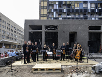 Conductor Herman Makarenko and the Kyiv Classic Orchestra are performing ''Requiem for the Dead'' at the ruins of Okhmatdyt Children's Hospi...