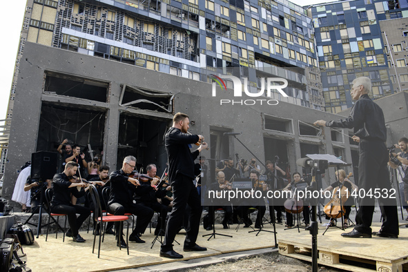 Conductor Herman Makarenko and the Kyiv Classic Orchestra are performing ''Requiem for the Dead'' at the ruins of Okhmatdyt Children's Hospi...