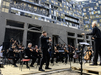 Conductor Herman Makarenko and the Kyiv Classic Orchestra are performing ''Requiem for the Dead'' at the ruins of Okhmatdyt Children's Hospi...