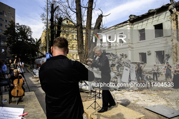 Conductor Herman Makarenko and the Kyiv Classic Orchestra are performing ''Requiem for the Dead'' at the ruins of Okhmatdyt Children's Hospi...