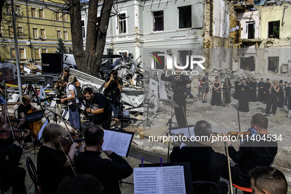 Conductor Herman Makarenko and the Kyiv Classic Orchestra are performing ''Requiem for the Dead'' at the ruins of Okhmatdyt Children's Hospi...