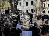 Conductor Herman Makarenko and the Kyiv Classic Orchestra are performing ''Requiem for the Dead'' at the ruins of Okhmatdyt Children's Hospi...