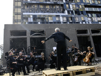 Conductor Herman Makarenko and the Kyiv Classic Orchestra are performing ''Requiem for the Dead'' at the ruins of Okhmatdyt Children's Hospi...