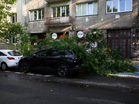 A small tree is falling on a car in the Mokotow district after an overnight storm is hitting Warsaw, Poland, on July 13, 2024. (