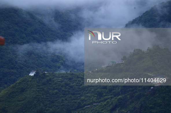 A view of Bosan Hill is being seen from Kirtipur after heavy rainfall in Kirtipur, Nepal, on July 13, 2024. 