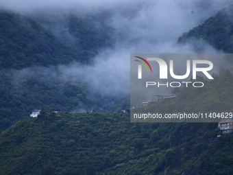 A view of Bosan Hill is being seen from Kirtipur after heavy rainfall in Kirtipur, Nepal, on July 13, 2024. (