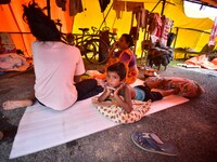 Flood-affected people are staying in a makeshift shelter in Nagaon District, Assam, India, on July 13, 2024. (