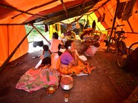 Flood-affected people are staying in a makeshift shelter in Nagaon District, Assam, India, on July 13, 2024. (