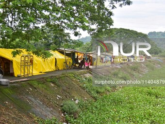 Flood-affected people are taking shelter in a makeshift camp in Nagaon District, Assam, India, on July 13, 2024. (