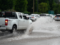 Citizens are traveling on a flooded road in Neijiang, Sichuan province, China, on July 13, 2024. (