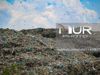 Heaps of garbage are being seen at an open garbage dumping site in Srinagar, Jammu and Kashmir, on July 13, 2024. The improper disposal of w...