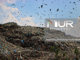 Heaps of garbage are being seen at an open garbage dumping site in Srinagar, Jammu and Kashmir, on July 13, 2024. The improper disposal of w...