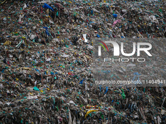 Heaps of garbage are being seen at an open garbage dumping site in Srinagar, Jammu and Kashmir, on July 13, 2024. The improper disposal of w...