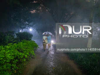 Citizens are walking through the rainstorm in central Chongqing, China, on July 13, 2024. (