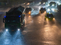 Citizens are walking through the rainstorm in central Chongqing, China, on July 13, 2024. (