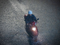 Citizens are walking through the rainstorm in central Chongqing, China, on July 13, 2024. (