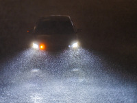 Vehicles are driving in the rainstorm in central Chongqing, China, on July 13, 2024. (